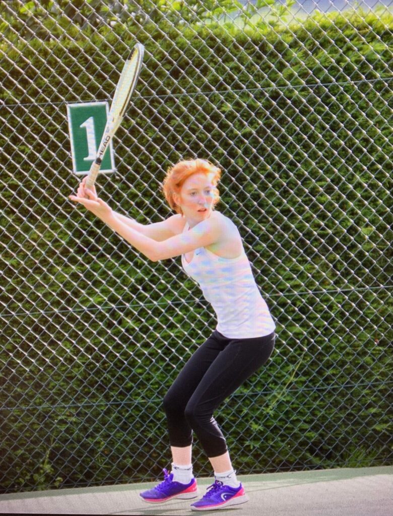 Megan playing tennis